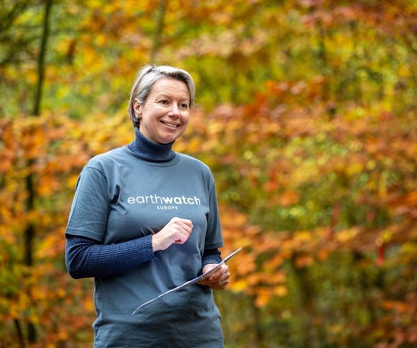 Lene smiling in the woods 